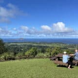 Couple enjoying views of Norfolk Island from Mount Pitt