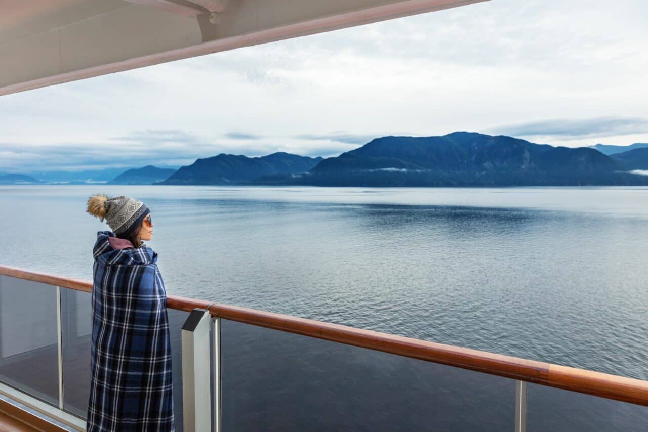 Alaska cruise with passenger looking at view