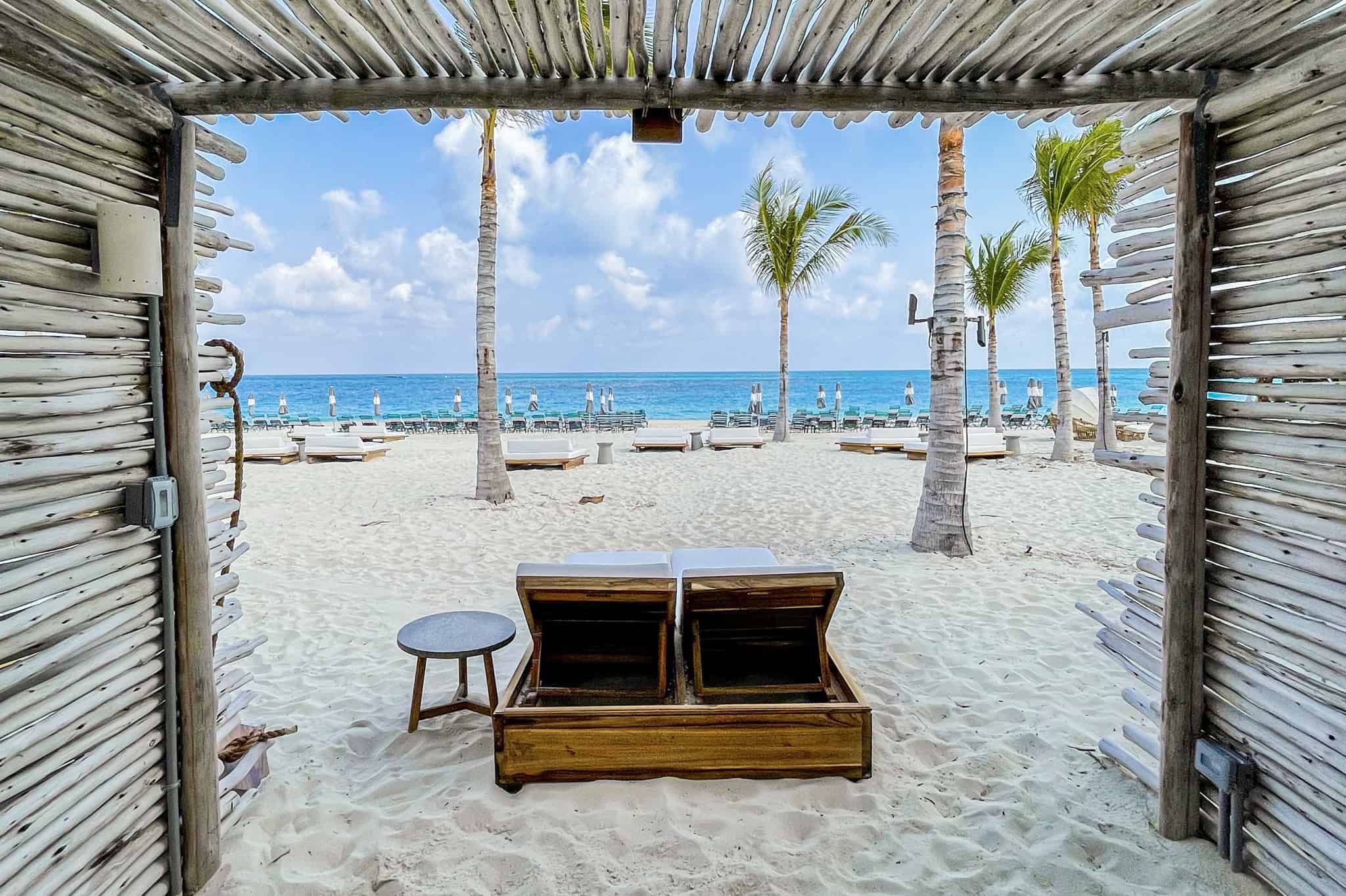 Virgin Voyages Bimini Beach Club with white sand cabana