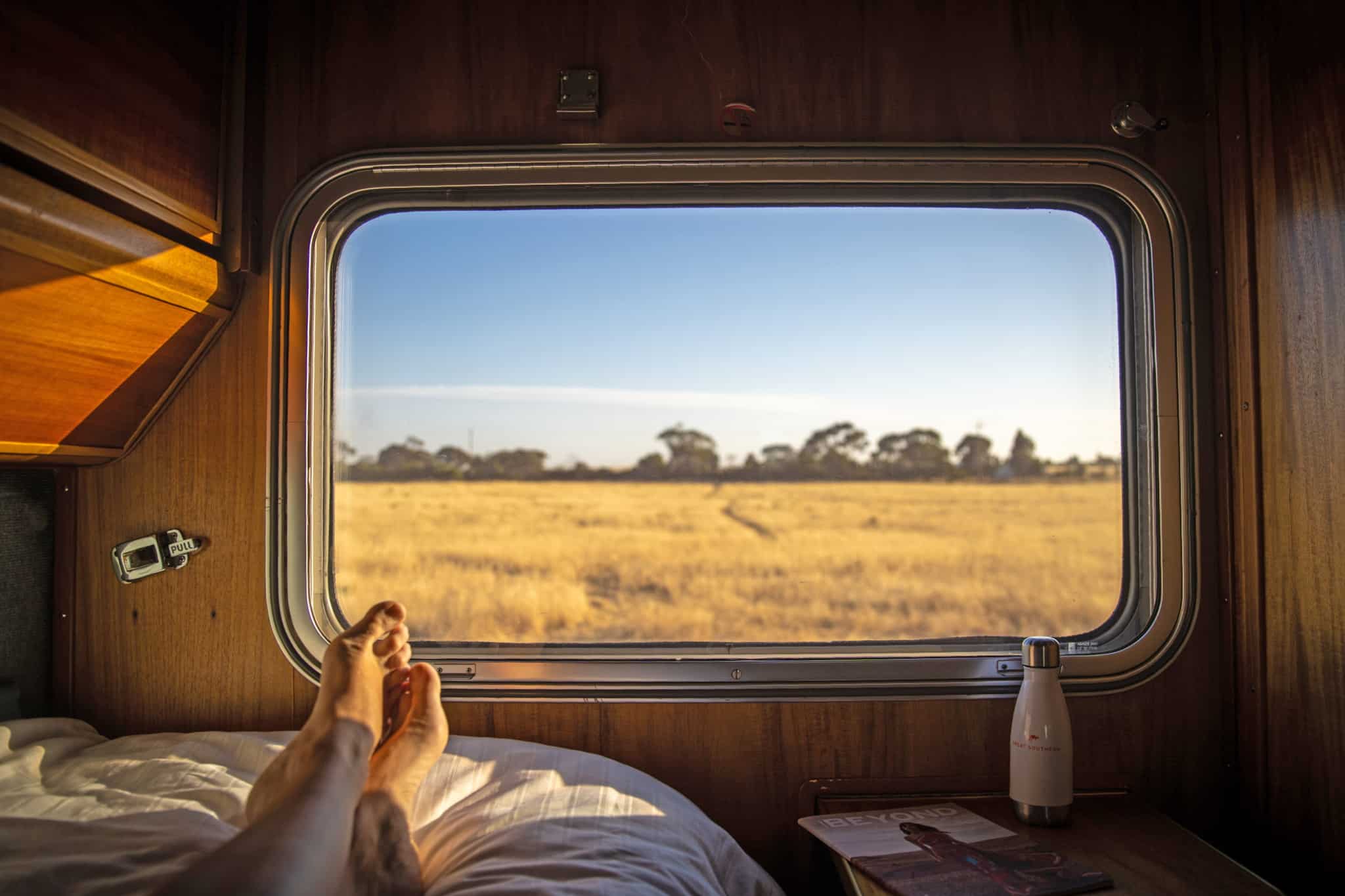 Ghan Gold cabin looking out window at sunrise