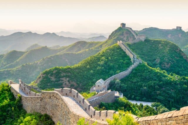 Great Wall of China at Badaling with views of the wall on green hills